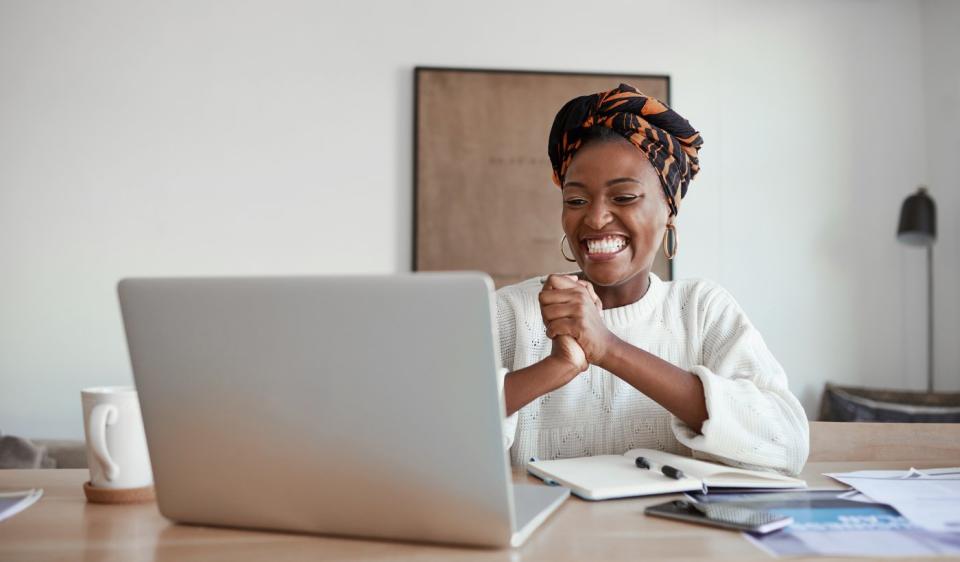 Happy person looking at laptop. 