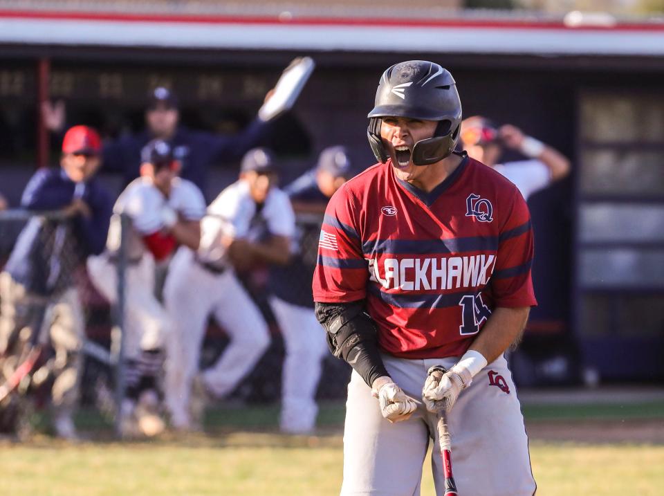 La Quinta's Abraham Calderon (14) celebrates a bases-loaded walk in the 10th inning during their division three semifinal game at La Sierra High School in Riverside, Calif., Tuesday, May 17, 2022.