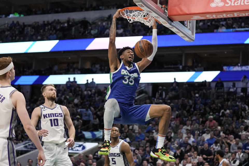 Dallas Mavericks forward Christian Wood dunks during the second half of the team's NBA basketball game against the Sacramento Kings in Dallas, Wednesday, April 5, 2023. (AP Photo/Sam Hodde)