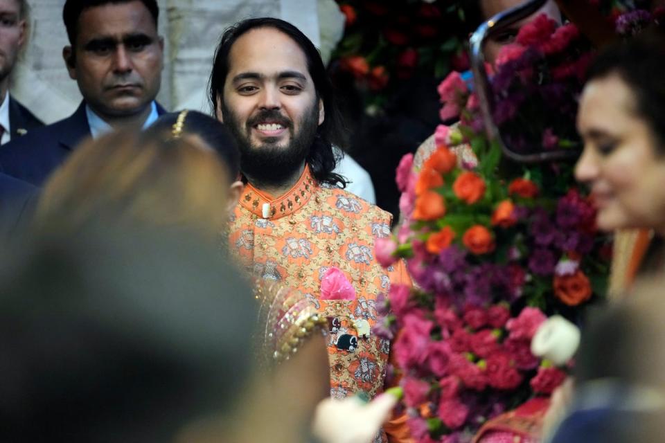 Anant Ambani, centre, smiles as he shares a light moment last week during his pre-wedding ceremony to Radhika Merchant. 