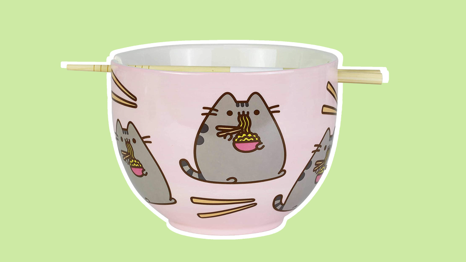 Everyone loves the adorable antics of Pusheen. This adorable bowl features her enjoying a nice bowl of noodles–how cute!