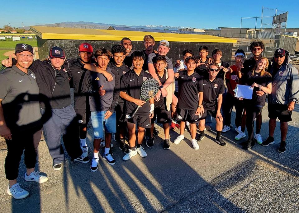 The Oak Hills boys tennis team poses for a photo after beating Hesperia on April 18, 2024 to end the season unbeaten at 15-0.