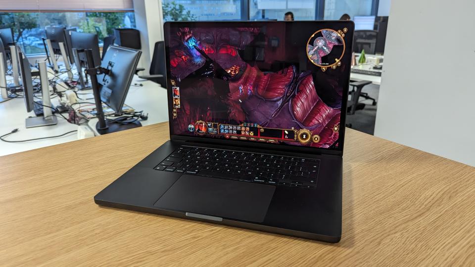 MacBook Pro 16-inch with screen open in an office