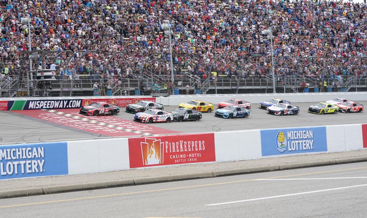 The FireKeepers Casino 400 race in August 2023 at Michigan International Speedway is pictured, restarting after a nearly two-hour delay because of storms and rain showers.