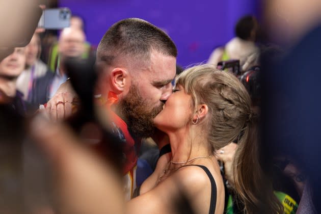 Travis Kelce kisses Taylor Swift following the NFL Super Bowl 58 - Credit: Michael Owens/Getty Images