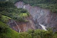 Ruptured pipelines at the site of an April 7, 2020 oil spill are seen dangling into ravine in the Amazon