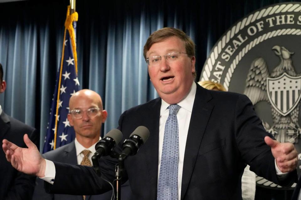 Mississippi Gov. Tate Reeves, right, announces a proposal that he says should alleviate financial problems for hospitals, during a news conference Thursday, Sept. 21, 2023, in Jackson, Miss. Associate Vice Chancellor for Clinical Affairs at the University of Mississippi Medical Center Dr. Alan Jones listens at left. (AP Photo/Rogelio V. Solis) Rogelio V. Solis/AP