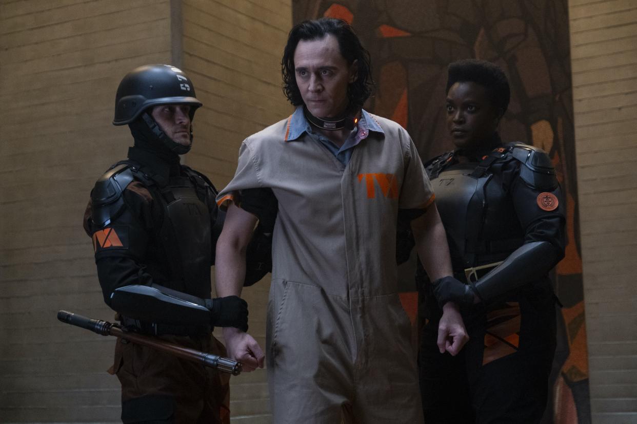 Loki (Tom Hiddleston) is in the custody of Time Variance Authority agents like Hunter B-15 (Wunmi Mosaku) in the season premiere of 'Loki' (Photo: Disney+)