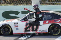 Harrison Burton gets out of his car after winning a NASCAR Xfinity Series auto race Saturday, June 13, 2020, in Homestead, Fla. (AP Photo/Wilfredo Lee)