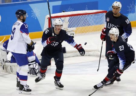 Ice Hockey - Pyeongchang 2018 Winter Olympics - Men's Playoff Match - U.S. v Slovakia - Gangneung Hockey Centre, Gangneung, South Korea - February 20, 2018 - Ryan Donato, Troy Terry and Jordan Greenway of the U.S. react after their second goal. REUTERS/Grigory Dukor