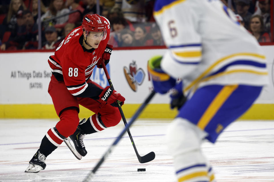 Carolina Hurricanes' Martin Necas (88) skates with the puck against the Buffalo Sabres during the second period of an NHL hockey game in Raleigh, N.C., Tuesday, Nov. 7, 2023. (AP Photo/Karl B DeBlaker)