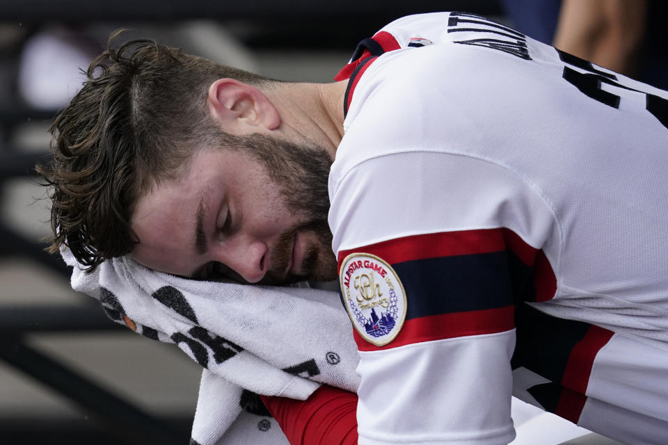 Chicago White Sox starting pitcher Lucas Giolito wipes his face in the dugout during the first inning of a baseball game against the Minnesota Twins in Chicago, Sunday, Sept. 4, 2022. (AP Photo/Nam Y. Huh)