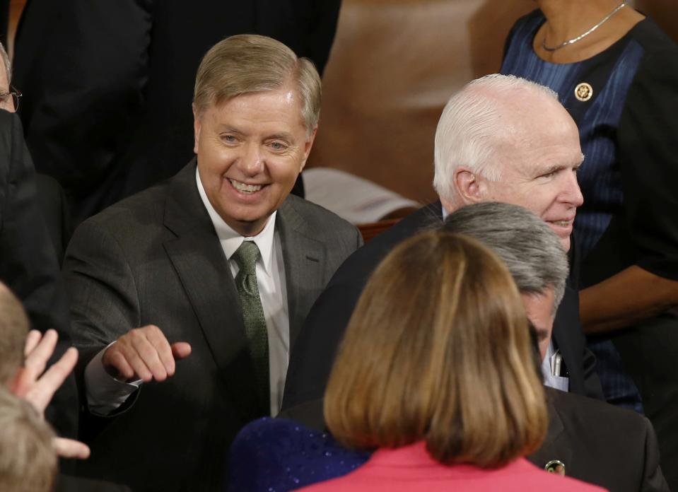 Republican Senator Graham of South Carolina and McCain of Arizona arrive for U.S. President Obama's State of the Union address to a joint session of the U.S. Congress on Capitol Hill in Washington