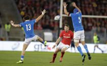 Wales' Jonah Holmes, center, challenges for the ball with Italy's Michele Campagnaro, left, and Italy's Dean Budd during the Six Nations rugby union international between Italy and Wales, at Rome's Olympic Stadium, Saturday, Feb. 9, 2019. (AP Photo/Andrew Medichini)