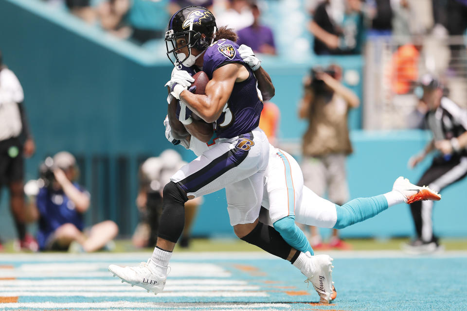 Willie Snead #83 of the Baltimore Ravens makes a catch for a touchdown against Jomal Wiltz #33 of the Miami Dolphins during the second quarter at Hard Rock Stadium on September 08, 2019 in Miami, Florida. (Photo by Michael Reaves/Getty Images)