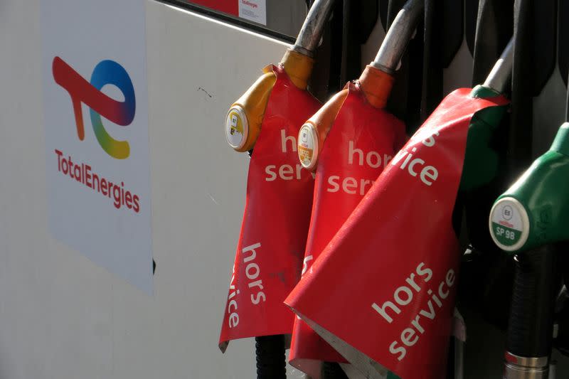 FILE PHOTO: Signs which read "out of order" are seen on gasoline pumps at a TotalEnergies gas station in Bugnicourt