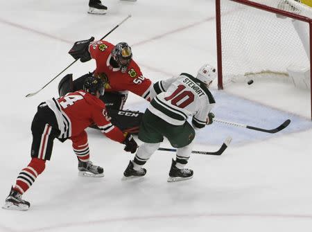 Oct 12, 2017; Chicago, IL, USA; Minnesota Wild right wing Chris Stewart (10) scores a goal against Chicago Blackhawks goalie Corey Crawford (50) during the third period at United Center. David Banks-USA TODAY Sports