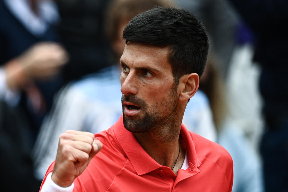 Novak Djokovic celebrates after beating Diego Schwartzman during their men's singles match on day eight of the French Open. (Photo by Christophe ARCHAMBAULT / AFP) (Photo by CHRISTOPHE ARCHAMBAULT/AFP via Getty Images)