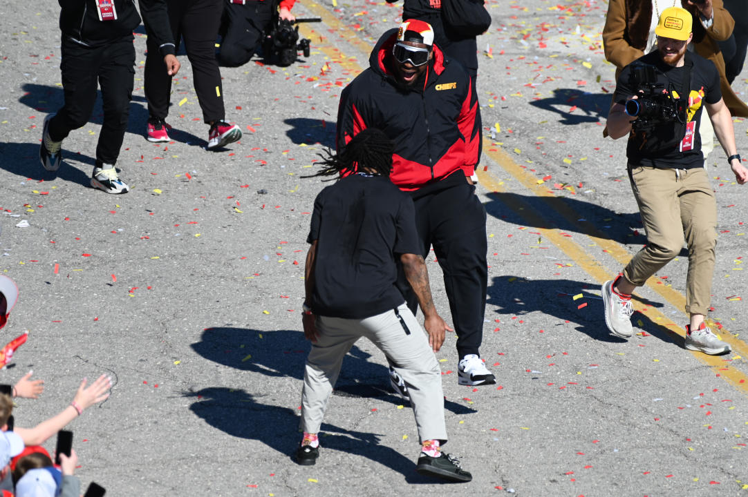 Trey Smith wearing a red and black jacket takes part in the Chiefs victory parade on Wednesday.