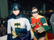 <p>Actors Adam West, left, and Burt Ward, dressed as their characters (Zappp!) Batman and (Powww!) Robin, pause during an appearance Jan. 27, 1989 at the “World of Wheels” custom car show in Chicago. (Photo: Mark Elias/AP) </p>