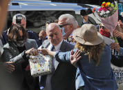 US Actor Johnny Depp, left, arrives at the High Court in London in London, Tuesday, July 28, 2020. Hollywood actor Johnny Depp is suing News Group Newspapers over a story about his former wife Amber Heard, published in The Sun in 2018 which branded him a 'wife beater', a claim he denies. (AP Photo/Frank Augstein)