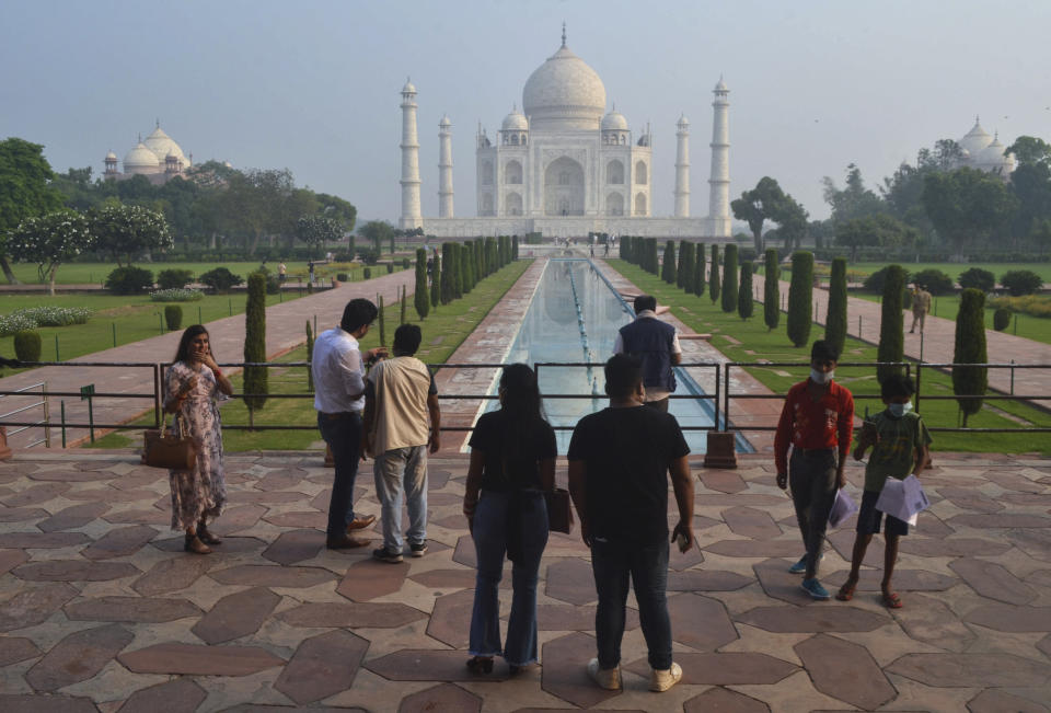 A small number of tourists visit as the Taj Mahal monument is reopened after being closed for more than six months due to the coronavirus pandemic in Agra, India, Monday, Sept.21, 2020. (AP Photo/Pawan Sharma)