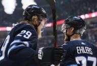 Mar 18, 2018; Winnipeg, Manitoba, CAN; Winnipeg Jets left wing Nikolaj Ehlers (27) celebrates a second period goal by right wing Patrik Laine (29) against the Dallas Stars at Bell MTS Place. Mandatory Credit: James Carey Lauder-USA TODAY Sports