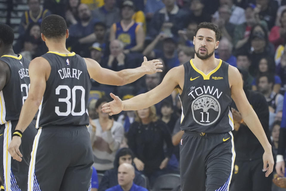 January 16, 2019; Oakland, CA, USA; Golden State Warriors guard Klay Thompson (11) celebrates with guard Stephen Curry (30) during the first quarter against the New Orleans Pelicans at Oracle Arena. Mandatory Credit: Kyle Terada-USA TODAY Sports