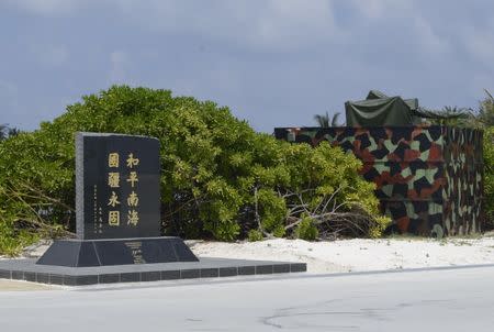 A memorial plaque signed by Taiwan President Ma Ying-jeou, which is engraved with the words, "Peace in the South China Sea and our national territory secure forever", is seen in Itu Aba, which the Taiwanese call Taiping, South China Sea, March 23, 2016. REUTERS/Fabian Hamacher