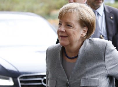 Leader of the Christian Democratic Union (CDU) Angela Merkel arrives at the Baden-Wuerttemberg State Representation office for exploratory talks about forming a new coalition government in Berlin, Germany, November 19, 2017. REUTERS/Axel Schmidt