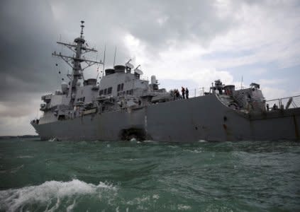 FILE PHOTO: The U.S. Navy guided-missile destroyer USS John S. McCain is seen after a collision, in Singapore waters August 21, 2017. REUTERS/Ahmad Masood/File Photo