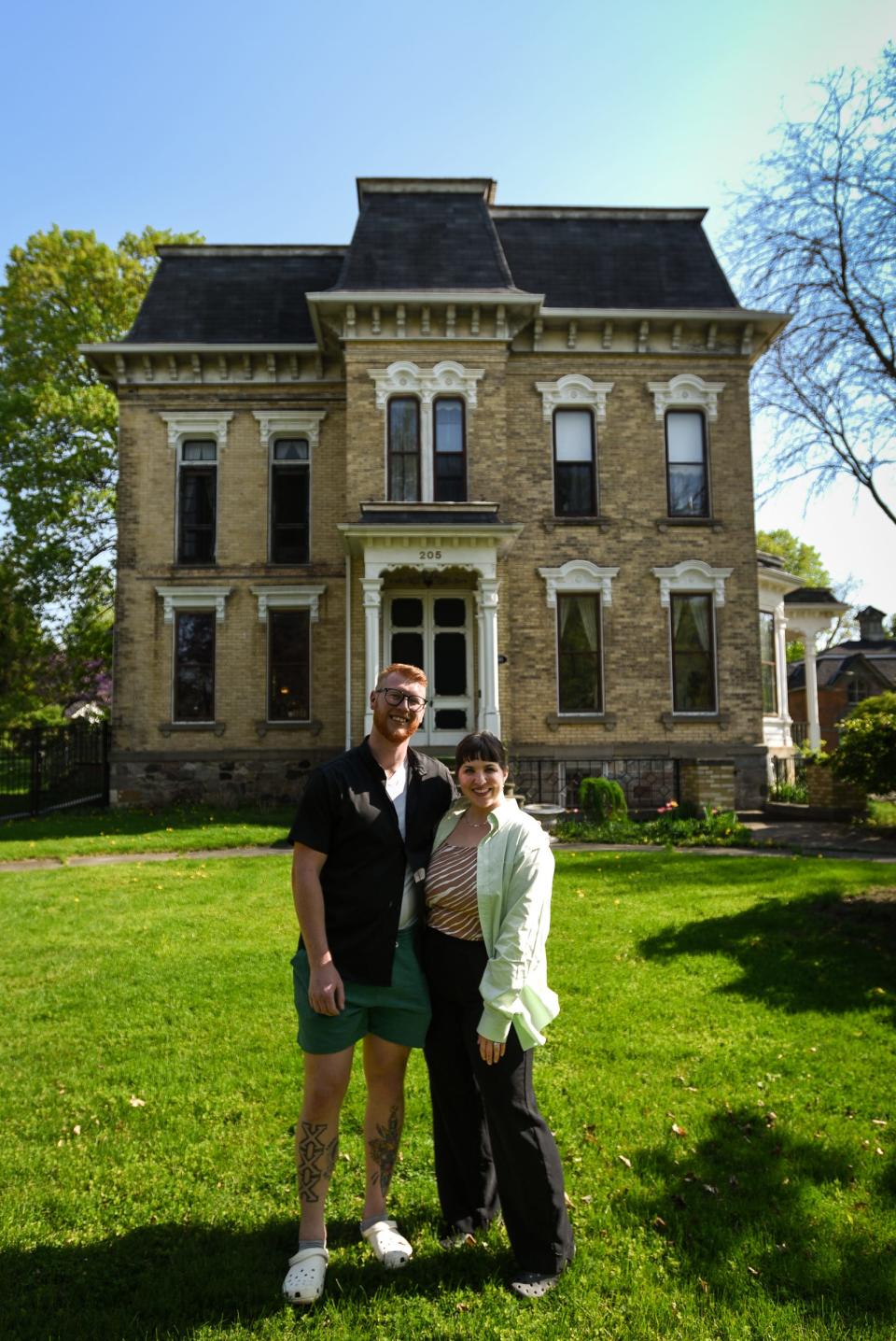 Trevor and Claire Breen, both 31, of St. Johns, pictured Tuesday, May 9, 2023, in front of their home in St. Johns, the historic Hicks Mansion, built in the 1870s.