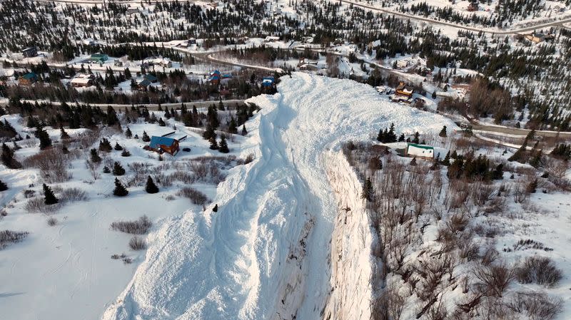 Drone footage shows the aftermath of an avalanche down a mountainside at Hiland Road in Anchorage