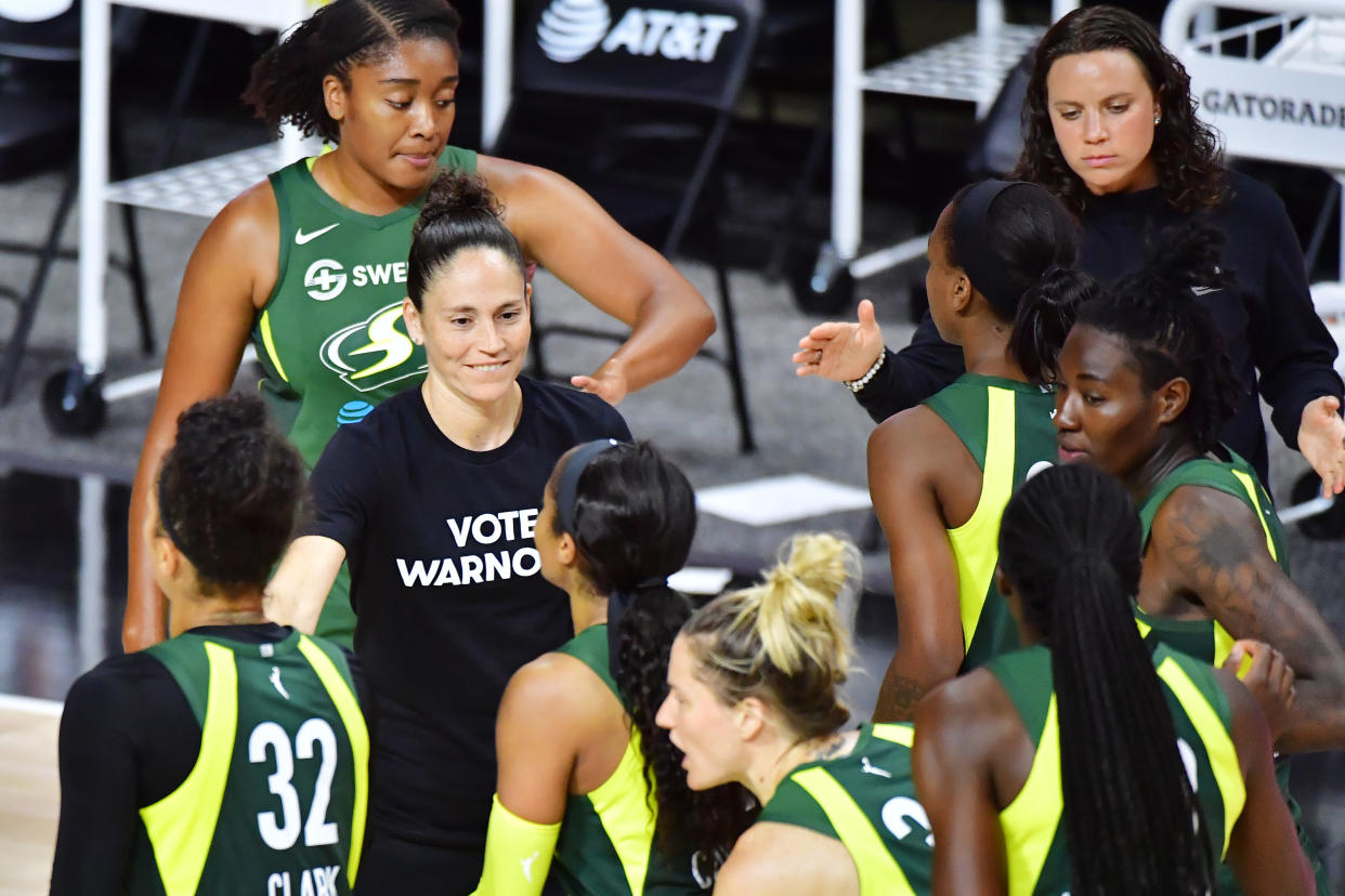 Sue Bird helped lead the "Vote Warnock" campaign with T-shirts in August. (Julio Aguilar/Getty Images)