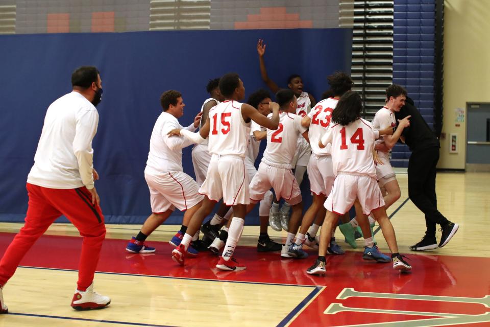 Indio basketball players celebrate their win against Yucca Valley in Indio, Calif., on Monday, Jan. 24, 2022. 