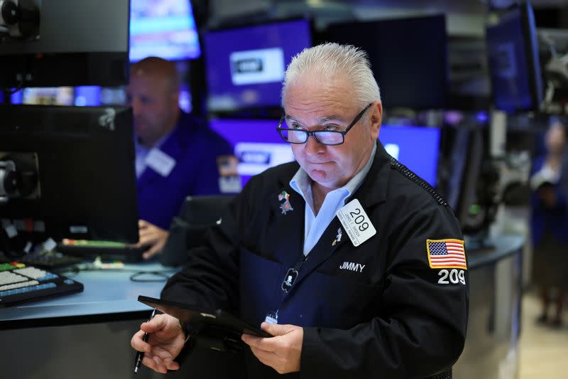 Traders work on the floor of the NYSE in New York