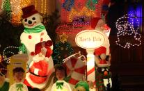 MELKSHAM, ENGLAND - DECEMBER 08: Christmas festive lights adorn a detached house in a suburban street in Melksham, December 8, 2012 in Melksham, England. The lights, a popular festive attraction, have returned to the town after a two-year absence and have raised thousands of pounds for charity for a local hospice, Dorothy House. The display, which is estimated to involve over 100,000 bulbs, worth over 30,000 GBP and even needed an up-rated electricity supply installed to cope with the additional power needed, is the brainchild of householder and electrician Alex Goodhind. This year, the display which Mr Goodhind began fifteen years ago now takes a team of professional electricians five weeks to complete, and even includes a snow machine. (Photo by Matt Cardy/Getty Images)