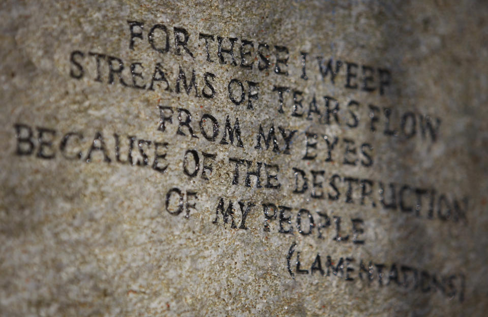 An inscription is seen engraved into a stone set in the Holocaust Memorial Garden in London's Hyde Park January 27, 2009. Holocaust Memorial Day is commemorated internationally on January 27, the anniversary of the date of the liberation of the Nazi concentration camp Auschwitz-Birkenau. REUTERS/Stephen Hird   (BRITAIN)