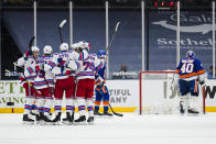 New York Islanders goaltender Semyon Varlamov (40) stands at the goal as the New York Rangers celebrate a goal by Kevin Rooney during the second period of an NHL hockey game Tuesday, April 20, 2021, in Uniondale, N.Y. (AP Photo/Frank Franklin II)