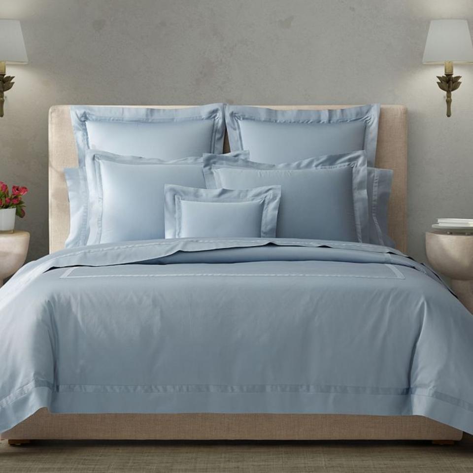 Matouk Nocturne Sateen Collection on a bed.