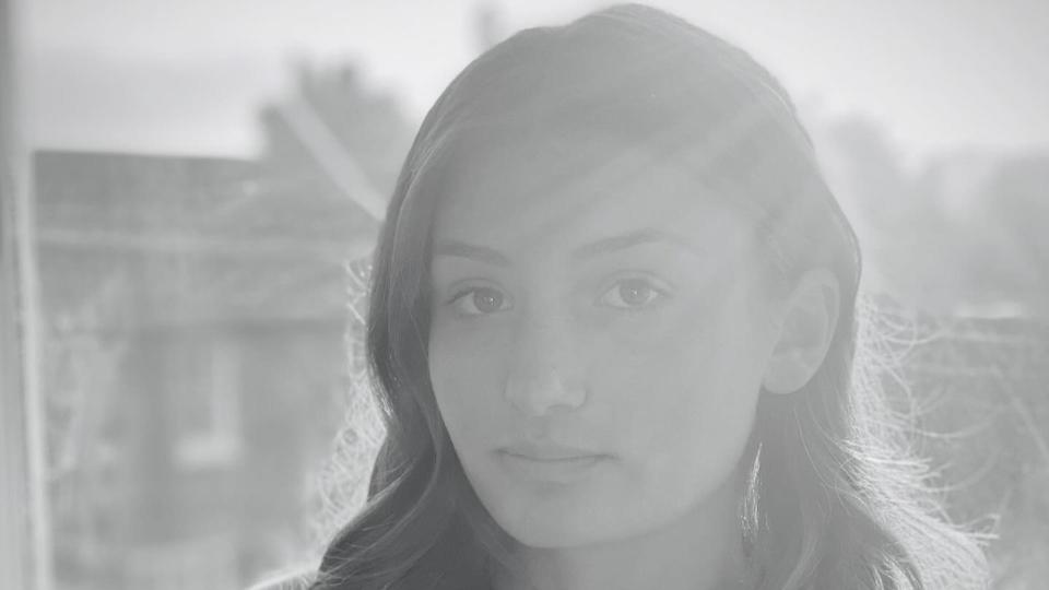 lady posing at home in black-and-white image