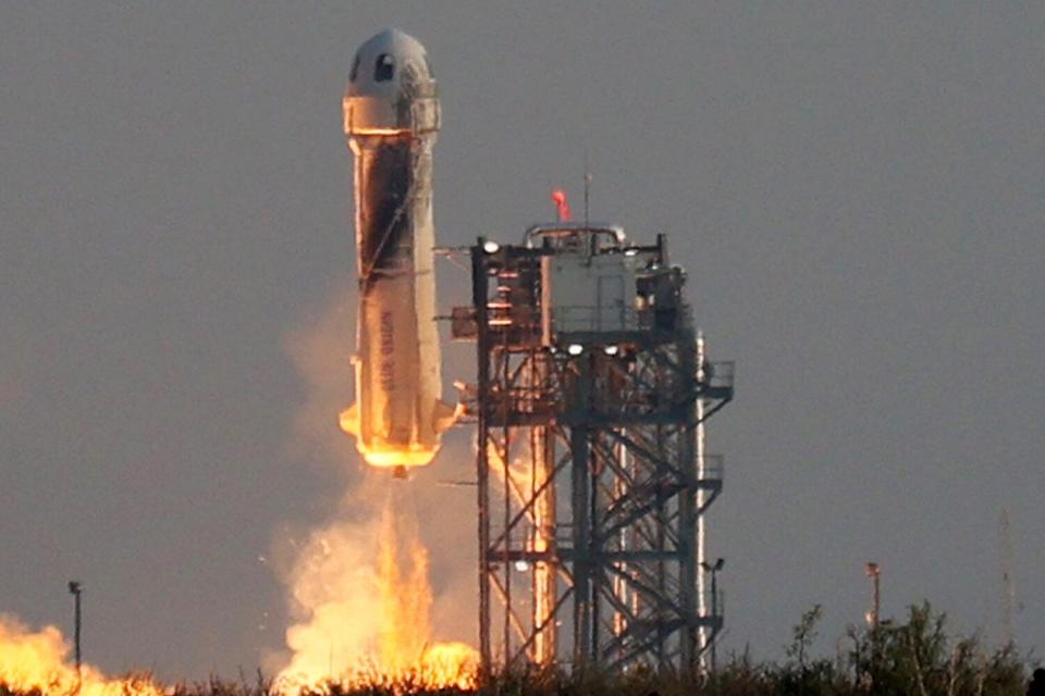 Blue Origin’s New Shepard lifts-off from the launch pad carrying Jeff Bezos along with his brother Mark Bezos, 18-year-old Oliver Daemen, and 82-year-old Wally Funk on July 20, 2021 in Van Horn, Texas. Mr. Bezos and the crew are riding in the first human spaceflight for the company.