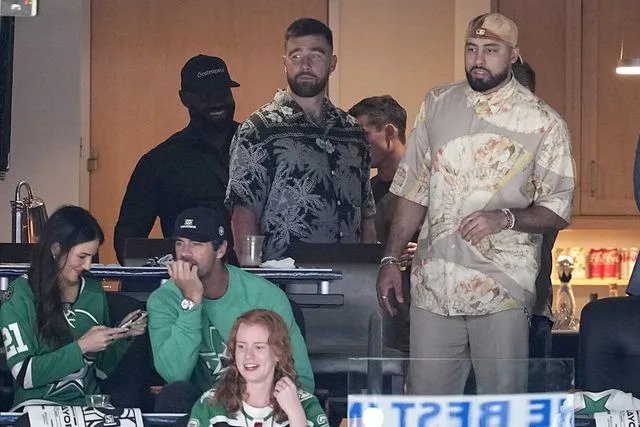 <p>AP Photo/Tony Gutierrez</p> Travis Kelce, center, and others take in Game 2 of the Western Conference finals in the NHL hockey Stanley Cup playoffs between the Edmonton Oilers and the Dallas Stars, Saturday, May 25, 2024, in Dallas.