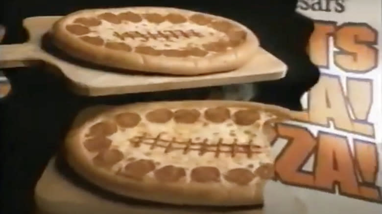 Football-shaped Little Caesars pizzas