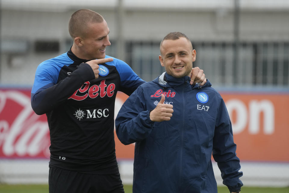 Napoli's Stanislav Lobotka, right, and teammate Leo Skiri Ostigard attend a training session at the club headquarters in Castel Volturno, near Naples, Wednesday, April 5, 2023. Unlike other major cities in Italy, Naples has only one major soccer team and the fan support for Napoli is felt on every street and alleyway. Lobotka, who developed with Ajax’s junior squad and then played for Danish club Nordsjaelland and Spanish side Celta Vigo before transferring to Italy, had never experienced anything like Napoli.(AP Photo/Gregorio Borgia)