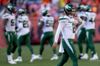 New York Jets quarterback Zach Wilson (2) walks to his bench during the second half of an NFL football game against the Denver Broncos, Sunday, Sept. 26, 2021, in Denver. The Broncos won 26-0. (AP Photo/David Zalubowski)