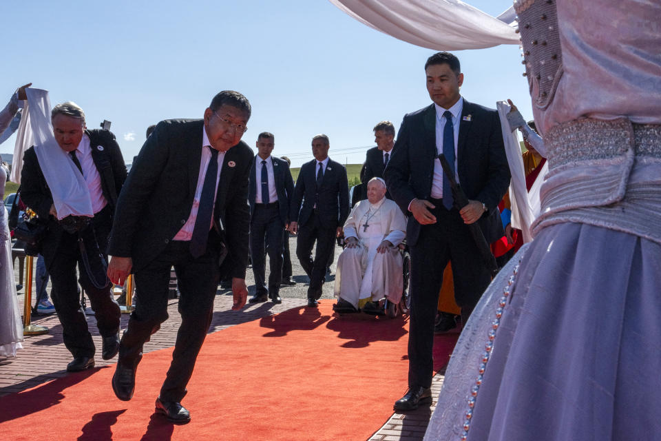 Pope Francis, center right, arrives at a meeting with religious leaders at the Hun Theatre in the Sky Resort compound some 15 kilometers south of the Mongolian capital Ulaanbaatar, Sunday, Sept. 3, 2023. Pope Francis has praised Mongolia’s tradition of religious freedom dating to the times of founder Genghis Khan during the first-ever papal visit to the Asian nation.(AP Photo/Louise Delmotte)