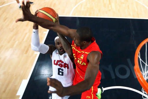 Serge Ibaka (R) of Spain defends against LeBron James (L) of the US during the London 2012 Olympic Games men's gold medal basketball game between USA and Spain at the North Greenwich Arena in London