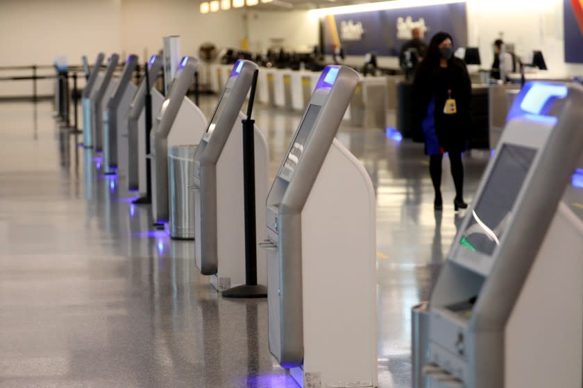 LOS ANGELES, CA -- APRIL 21: Southwest Airlines ticketing kiosk and counters are vacant as the coronavirus outbreak has brought passenger traffic to a near halt with travel down 95% at LosAngeles International Airport, the nation's second busiest, on Tuesday, April 21, 2020, in Los Angeles, CA. (Gary Coronado / Los Angeles Times)