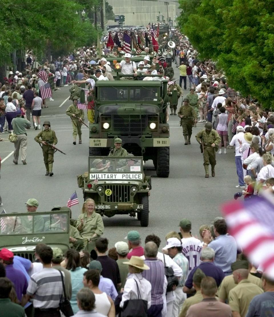 FILE- In this June 6, 2020 file photo, World War II veterans participate in a parade as part of the events celebrating the opening of the National D-Day Museum in New Orleans. The museum was designated the National World War II museum a few years after it opened. Before the COVID-19 pandemic hit, the National WWII Museum in New Orleans was planning on a 20th anniversary crowd of thousands. (AP Photo/Bill Haber, File)